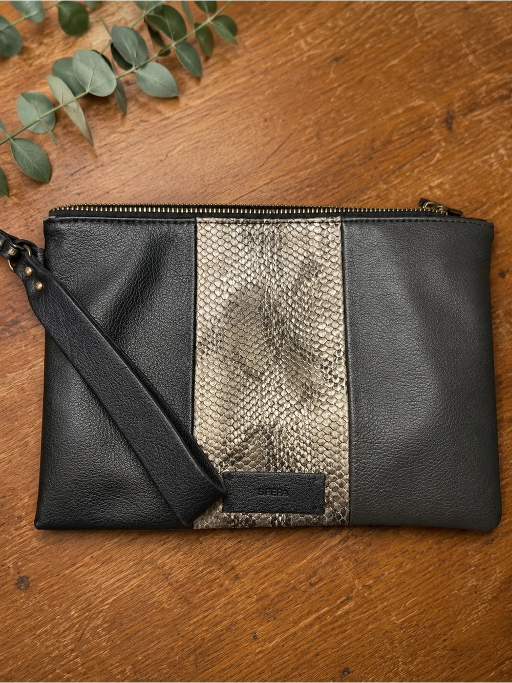 SFERA FEMME Black faux Leather Wristlet with Metallic Snake-Print Center